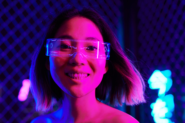A cyberpunk woman with short hair in transparent glasses with one lens and cybernetic engraving on them smiles to the teeth in a room with neon lighting a mesh net and neon lights