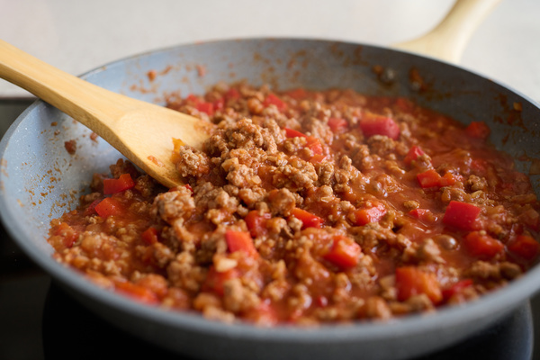 Bolognese Sauce Is Cooking in a Frying Pan