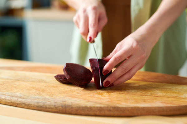 A Smoothie Maker Slices Beetroot for Smoothie