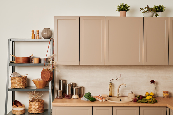 A shelf with eco accessories on it and products on a beige kitchen unit