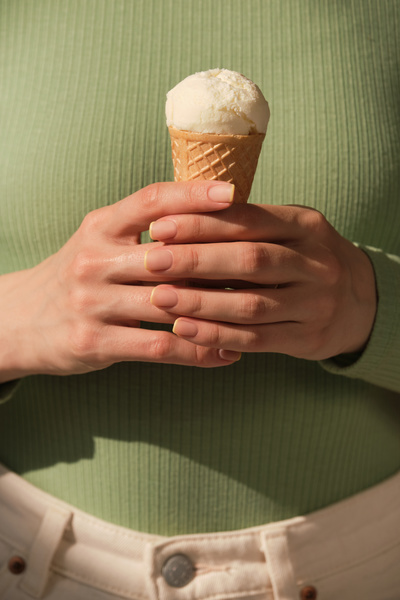 A Woman Holding Vanilla Ice Cream