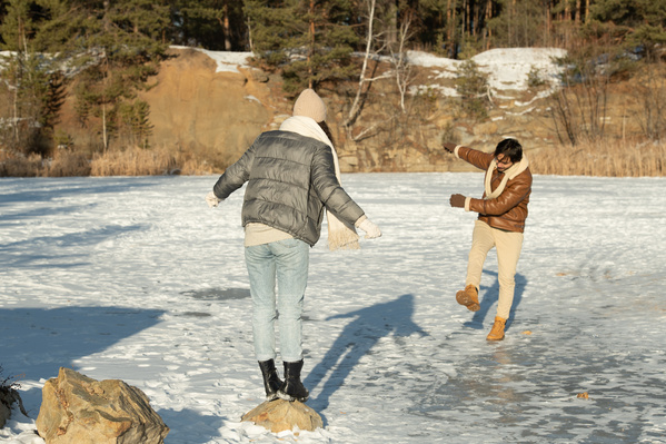 Loving Couple Having Fun on a Frozen Lake