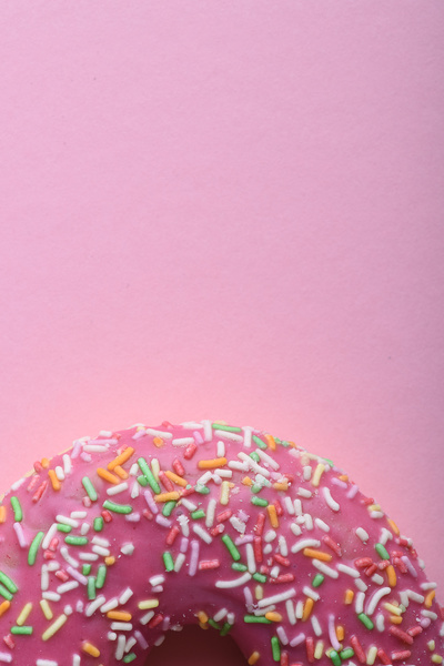 Pink Donut with Multicolored Sprinkles