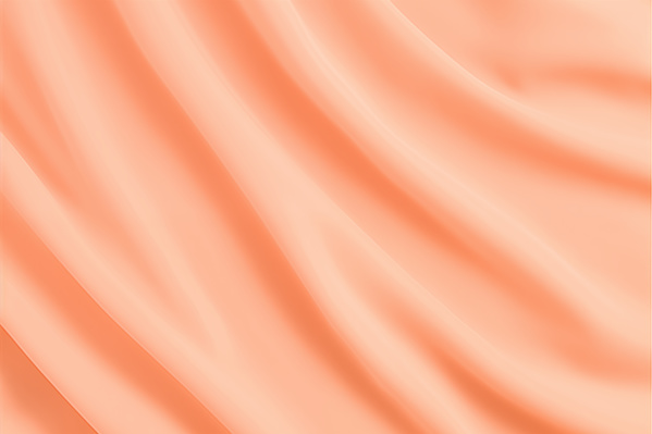 A Peach Colored Silk Fabric Is Shown in a Close up View