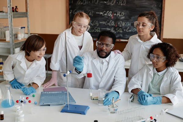 A Group of People Wearing Lab Coats and Goggles