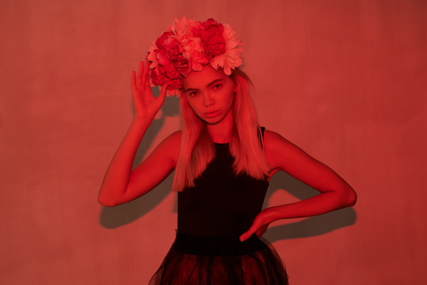 Woman with Wreath of Flowers on Her Head by Red Lighting - Stock Image ...